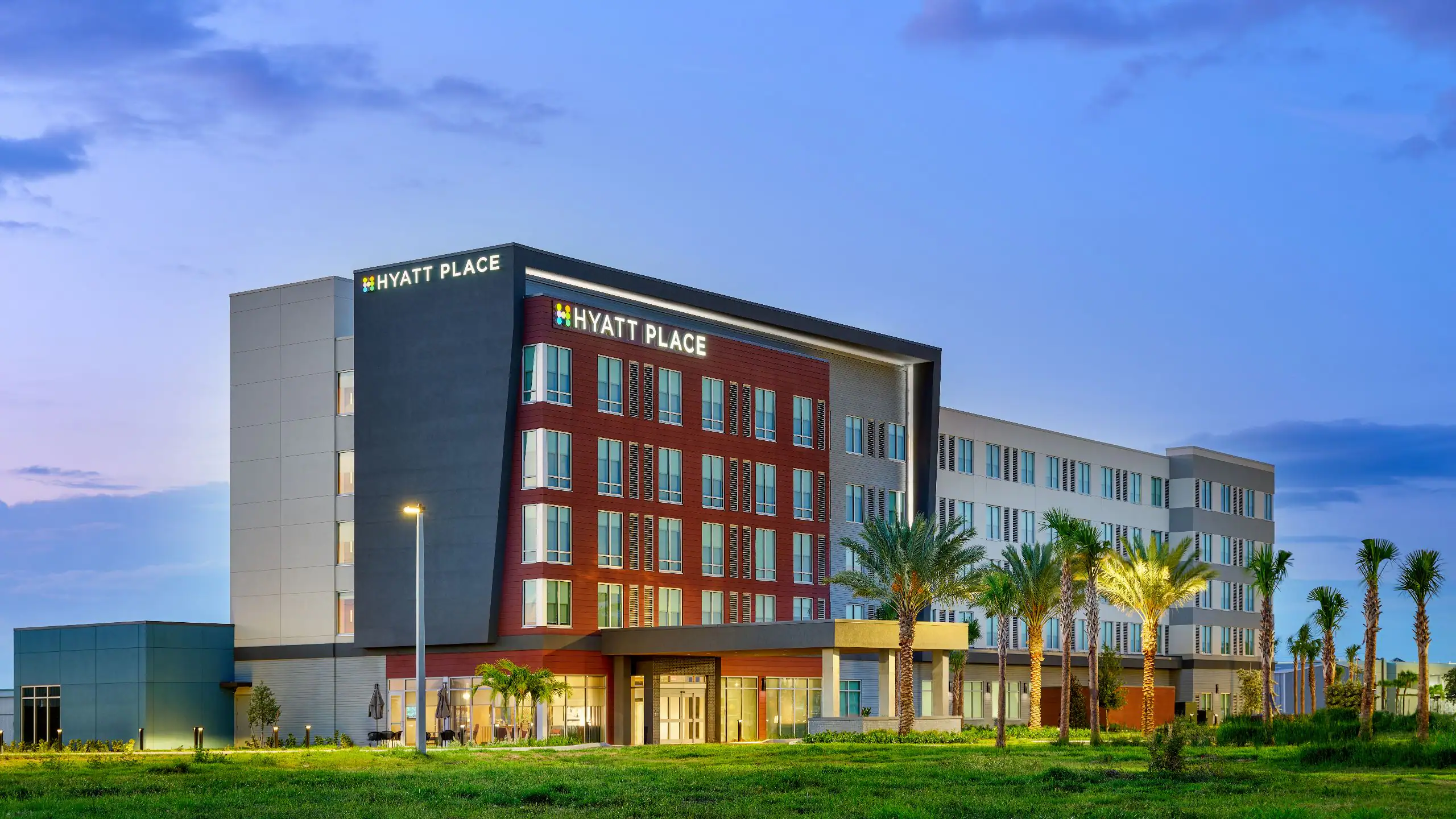 MCOZA-P0012-Hotel-Exterior-Dusk.16x9-1.webp